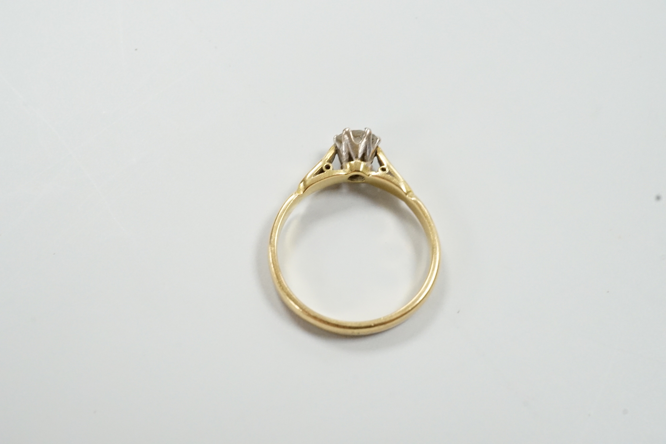An 18ct and solitaire diamond set ring, size O, gross weight 3.6 grams.